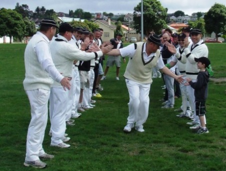 Darren Nagle runs through an avenue of honor created by team-mates for his 300th game.